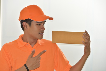 Delivery Business And online delivery services. Business Start up SME concept. Young startup entrepreneur small business owner working at home, packaging and delivery situation.の写真素材