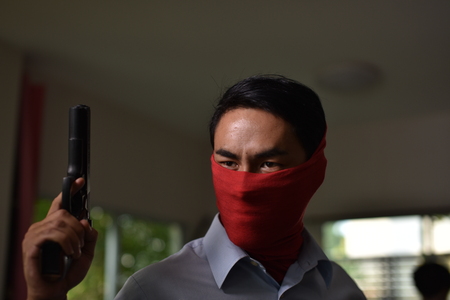 Robbery with firearms Intruded into the house. Dangerous Concepts in Everyday Lifeの写真素材