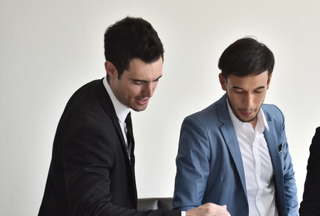 Young businessmen man Talk to a good meeting. Smile to each other.Business People Meeting Design Ideas Concept. Team Meeting Brainstorming Planning Analysing Concept.の写真素材