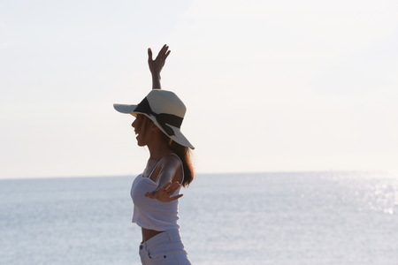 Fitness couples and yoga sunrise at the beautiful beach in the early morning. Exercise and yoga....