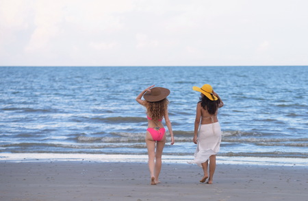 Beautiful model under the swimsuit. Have fun at the beach in the evening. Photos of beautiful women in swimwear at the beachの写真素材