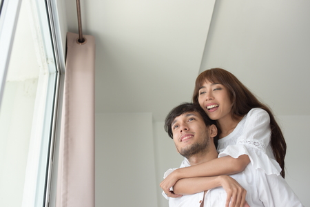 Romantic couples in the living room. On a sweet holidayの写真素材