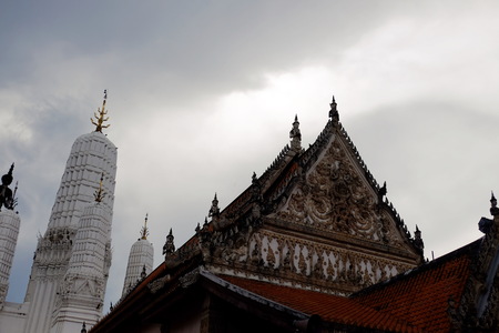 Thai temples and beautiful white pagoda are beautiful stucco designs. The ancient Buddha image. Wat Phra Mahathat Phetchaburi, Thailand.の写真素材