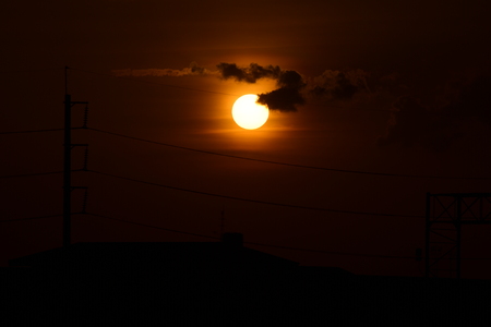 Sunset.High-power transmission towers with beautiful skies are golden in the pre-dark days.の写真素材