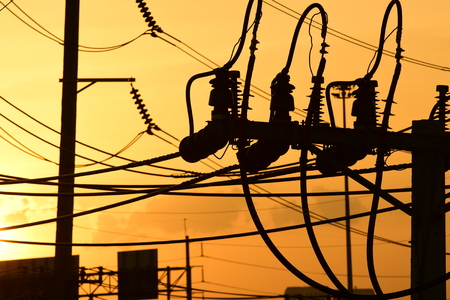 Sunset.High-power transmission towers with beautiful skies are golden in the pre-dark days.