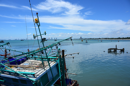 Sea view and small boat At the fishing pier and small fishing boat You can see the hotel building. Pattaya Beach and Jomtien Beach Thai life at Sattahip, Chonburi View on port of bangsare fishing pier with small fishing boatsのeditorial素材