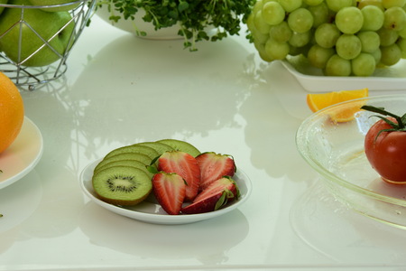 Composition with variety of organic vegetables and fruits. Balanced diet. colored fruit on the table.Set of different fresh fruits isolated on white.Set of different fresh fruits isolated on whiteの写真素材