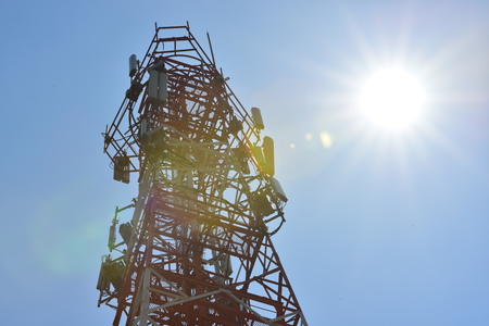 Wireless Communication Antenna With bright sky.Telecommunication tower with antennas with blue sky.の写真素材