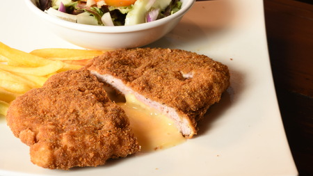 Homemade Breaded German Weiner Schnitzel with saladの写真素材
