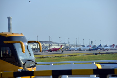 The plane is flying into the airport to land at Suvarnabhumi Airport. Thailand. The plane is tilting to turn into the airport.のeditorial素材