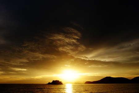 Sunset at the beautiful beach view Among the many people come to play in the sea before the...