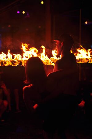 Fire show performance at a beachfront restaurant in Thailand tourist attraction