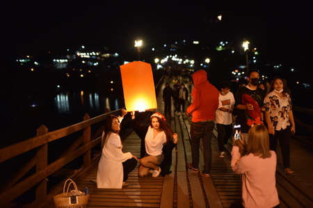 Unidentified people celebrate Loy Krathong festival in Kanchanaburi, Thailand.の写真素材