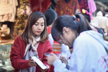 Unidentified Thai people sell souvenirs in Chiang Mai, Thailand.の写真素材