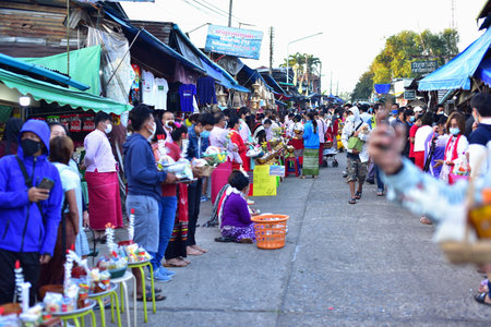 Unidentified people buy food and souvenirs at local market in Nakhon Ratchasima, Thailand.の写真素材