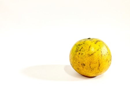 An orange fruit isolated on white backgroundの写真素材