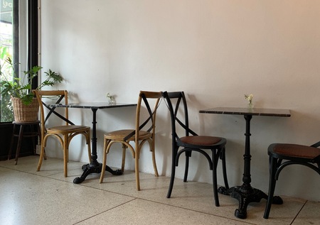 Set of tables, chairs and chairs in the cafe, decorated in a corner