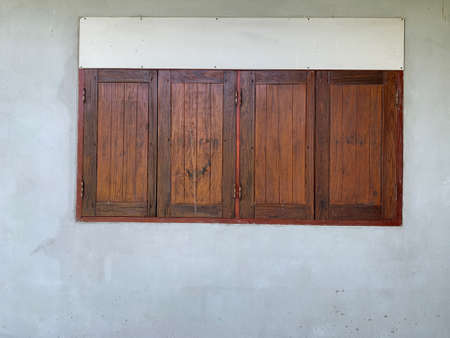 Vintage style wooden window on the cement background