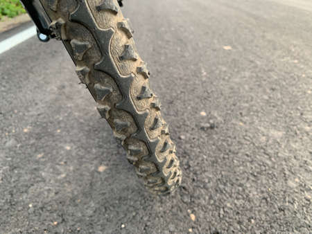 Old bicycle tires that break on the concrete floorの写真素材