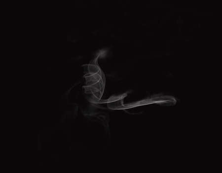 a shape of smoke spreading on dark backgroundの写真素材