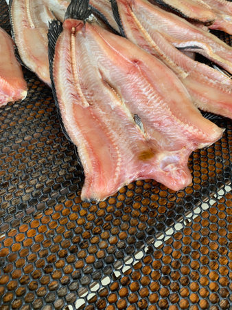 Dried fish in the market, closeup of a fresh fish