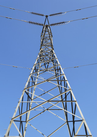 Tower of high-voltage lines with blue sky background.の写真素材
