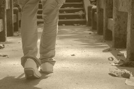 Man walking on the bridge. (retro style filter, leave space for text)の写真素材