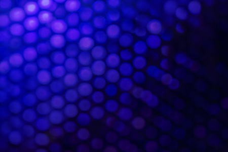 Blurred blue bokeh of honeycomb, made with color effect filter.の写真素材