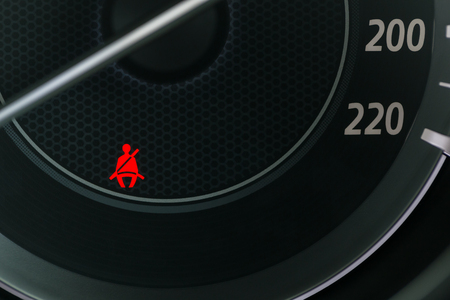 Car Dashboard showing the seat belt warning lightの写真素材