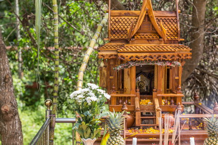Beautiful Thai style spirit house or house of the guardian spirit is made of wood and sculptured wood. Thai houses ancient style pattern. Foreshorten. のeditorial素材