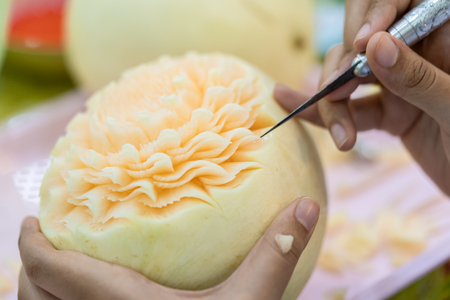 Thai fruit carving is a traditional. Thai art that requires neatness, precision, meditation, and personal ability. Fruit carving persisted in Thailand as a respected art for centuries.の写真素材