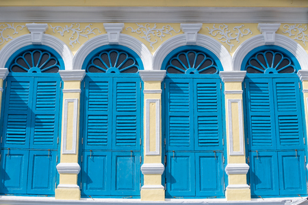 Bright vintage Sino-Portuguese Architecture of many the buildings in Phuket town. These old buildings have been constructed more than hundred years and this architectural style is European mixed with Chinese modern. Phuket, Thailand.の写真素材