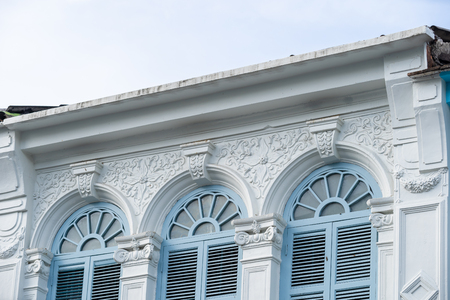 Bright vintage Sino-Portuguese Architecture of many the buildings in Phuket town. These old buildings have been constructed more than hundred years and this architectural style is European mixed with Chinese modern. Phuket, Thailand.の写真素材