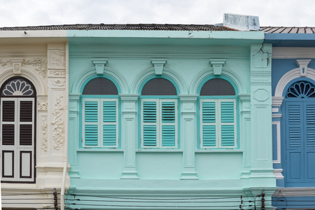 Bright vintage Sino-Portuguese Architecture of many the buildings in Phuket town. These old buildings have been constructed more than hundred years and this architectural style is European mixed with Chinese modern. Phuket, Thailand. Ancient window.の写真素材