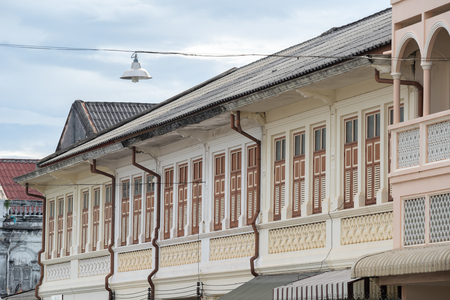 Bright vintage Sino-Portuguese Architecture of many the buildings in Phuket town. These old buildings have been constructed more than hundred years and this architectural style is European mixed with Chinese modern. Phuket, Thailand. Ancient window.の写真素材