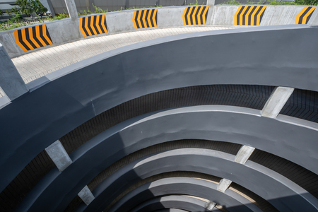 multi-storey car parking. Circular ramp in the multi Level parking garage, Top view.の写真素材