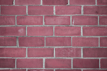 Old brick wall with scratches and grunges as textureの写真素材