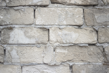 Old brick wall with scratches and grunges as textureの写真素材