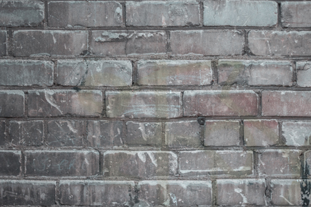 Old brick wall with scratches and grunges as textureの写真素材