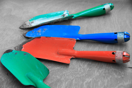 colorful tools red green blue shovels for garden workの写真素材