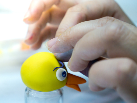 Woman's hand Working hand made sculpture clay
with colors Into various shapes.の写真素材