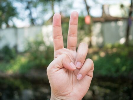 background
Men's hand
Hold two fingers.
Be a symbol to fight or not give up.の写真素材