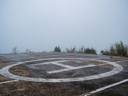 Helipad Amidst strong winds, With dense fog, High mountain, In the national park, Thailand.の写真素材