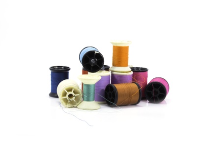 bobbins of thread on a white backgroundの写真素材