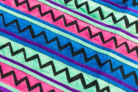 Colorful Thailand style rug surface close up vintage fabric is made of hand-woven cotton fabric More of this motif , backgroundの写真素材
