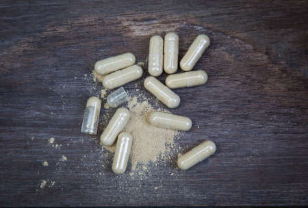 many capsule pill on wooden backgroundの写真素材