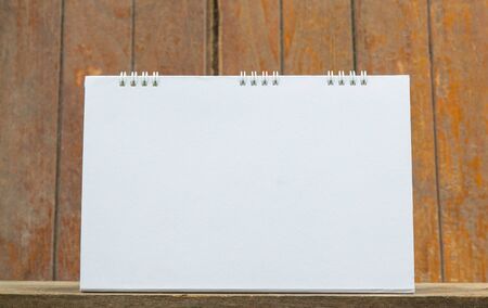 Blank calendar on wood tableの写真素材