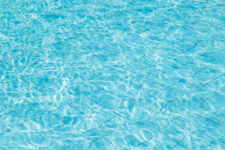 Blue ripped water in swimming pool.