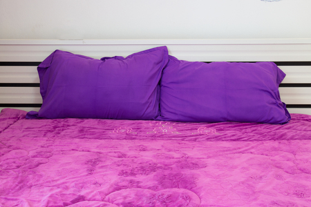 Bed in a hotel room , Thailand.の写真素材