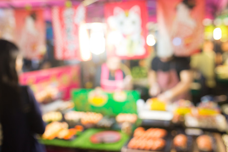 Abstract blur image of train night market in bangkok, Thailand.の写真素材